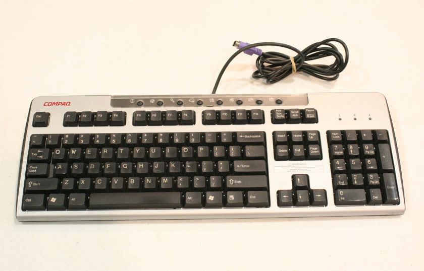   This listing is for a pre owned Compaq KB 0133 in fair condition